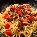 Pasta con calamares luminosos