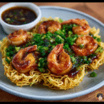 Langostinos al tamarindo sobre nidos de fideos crujientes con gremolata de cilantro