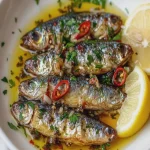 Sardinas Poached en Aceite de Ajo y Chile First Image First Image